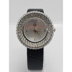 Paris Hilton women's dress watch. Large jeweled bevel. Working watch